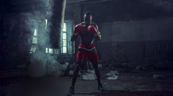 hand-of-boxer-over-black-background-strength-L7JXP4Q-min