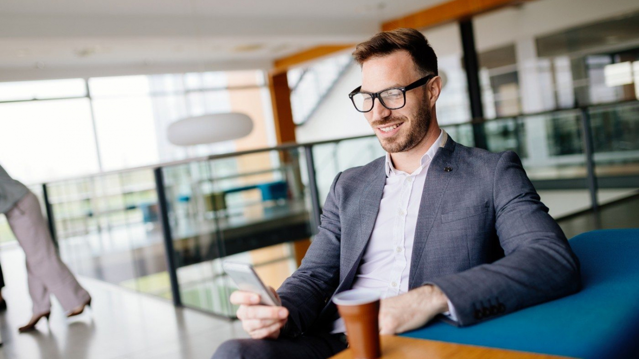 businessman-taking-a-break-with-a-cup-of-coffee-JW4B3DH-min